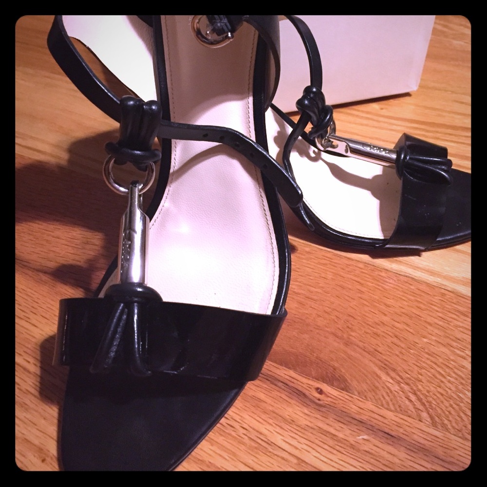 Black and silver Coach Brand heels